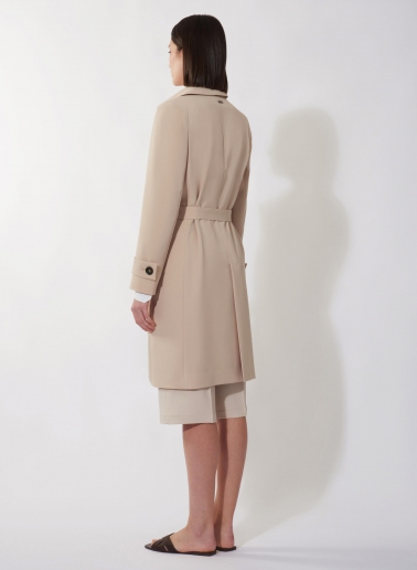 Single breasted beige trench coat in technical fabric with hand stitches