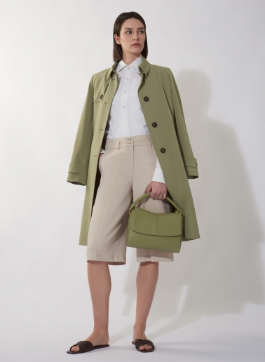 Single breasted military green trench coat in  technical fabric with hand stitches
