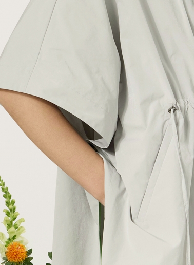 Pearl grey hooded cape with strings in rainproof technical fabric