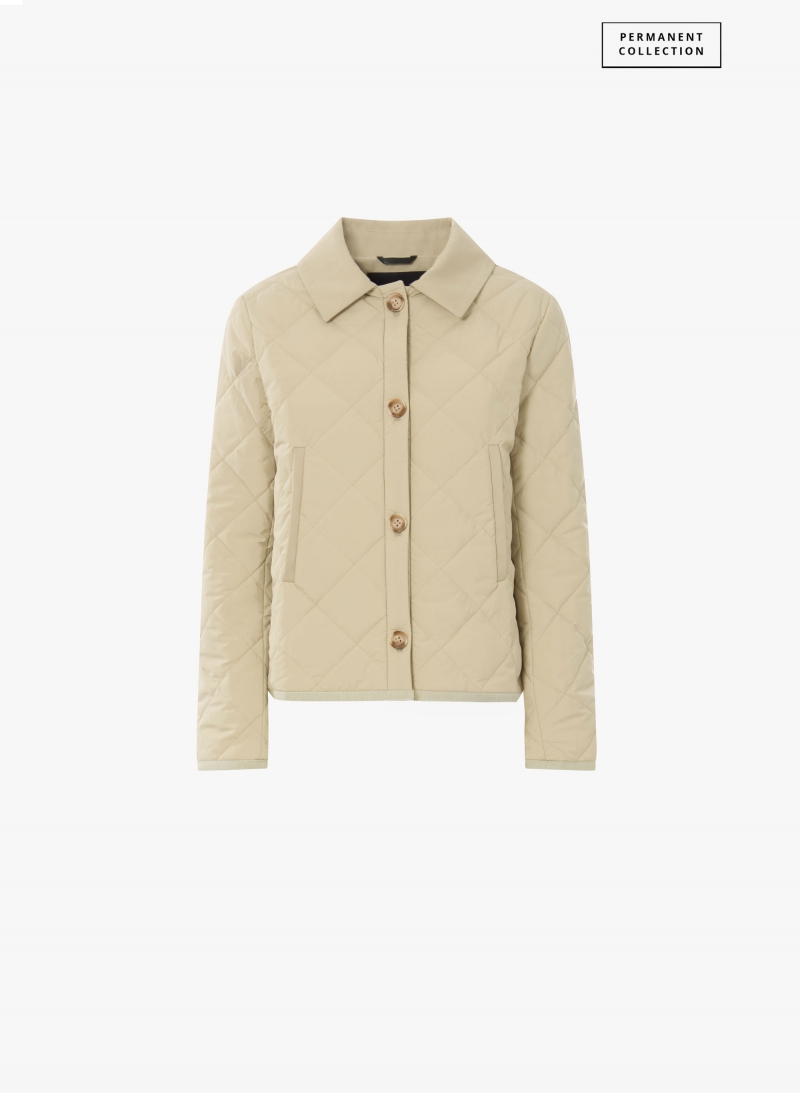 Giacca beige trapuntata con collo a camicia e dettagli in contrasto