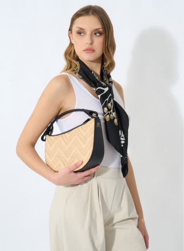 Asymmetrical straw bag with black leather details