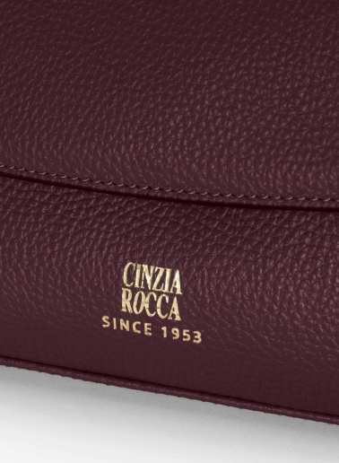 Burgundy leather shoulder bag with integrated handle and strap