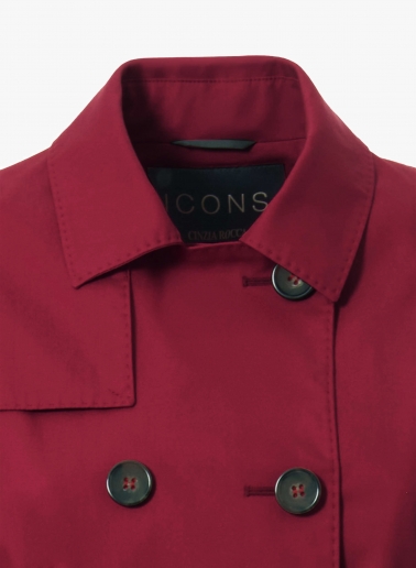Double-breasted red trench coat in technical fabric with tailored stitches