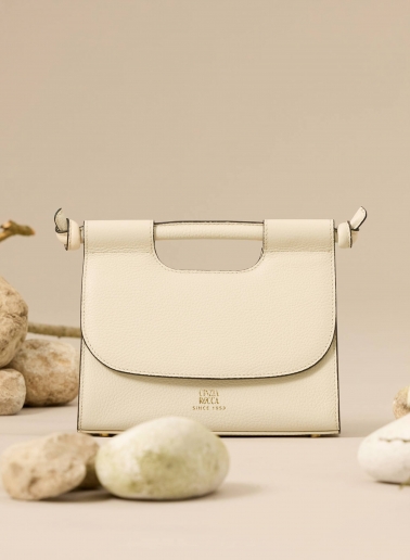 Beige leather shoulder bag with integrated handle and strap