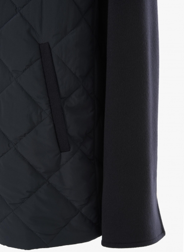 Dark blue quilted jacket with contrasting wool sleeves