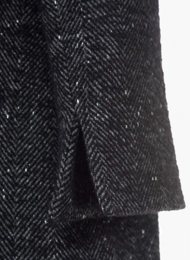 Short black coat with lurex micro pattern and high stand up collar