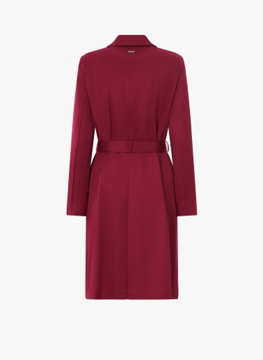 Double-breasted red trench coat in technical fabric with tailored stitches