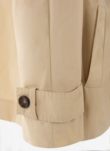 Double breasted beige jacket with maxi notch collar in rainproof technical fabric