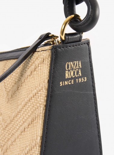 Asymmetrical straw bag with black leather details