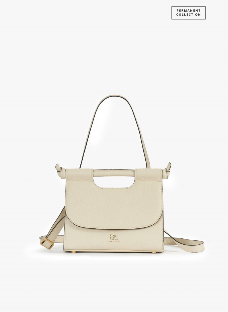 Beige leather shoulder bag with integrated handle and strap