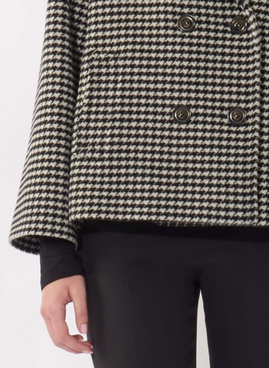 Short oversized black houndstooth coat in pure wool with maxi notch collar