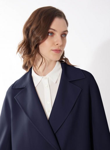 Assymetrical blue overcoat in comfort wool