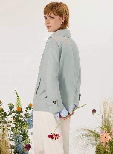Double breasted light blue jacket with maxi notch collar in rainproof technical fabric