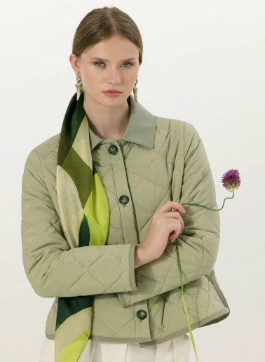 Military green quilted jacket with shirt collar and contrasting details