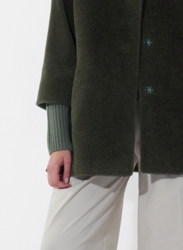 Short oversized green alpaca and wool coat with knitted details
