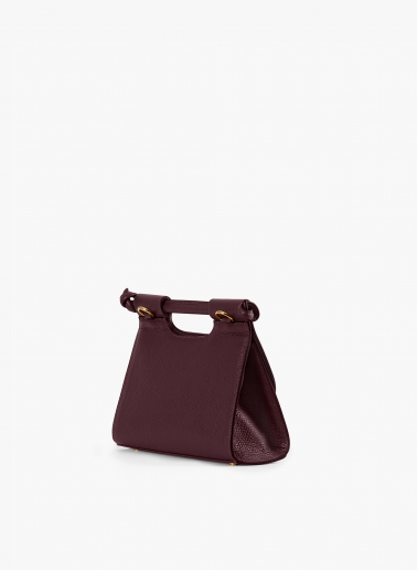 Burgundy leather shoulder bag with integrated handle and strap