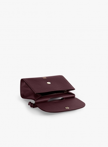 Burgundy leather shoulder bag with integrated handle and strap