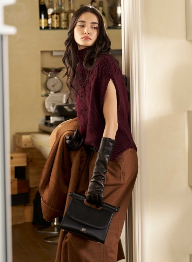 Burgundy knitted cape with braided detail