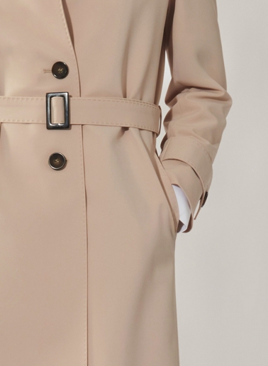 Single breasted beige trench coat in technical fabric with hand stitches