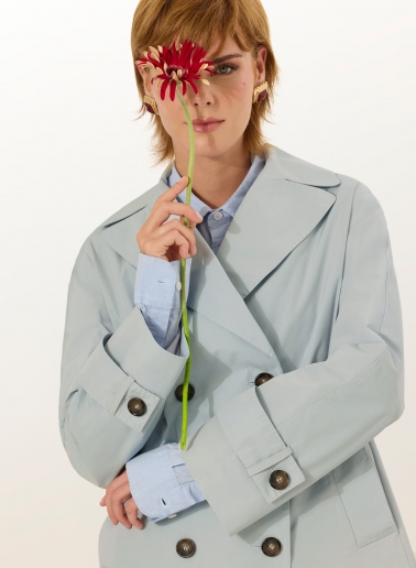 Double breasted light blue jacket with maxi notch collar in rainproof technical fabric