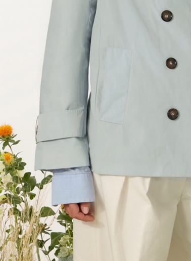 Double breasted light blue jacket with maxi notch collar in rainproof technical fabric