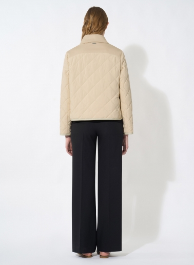 Beige quilted jacket with shirt collar and contrasting details
