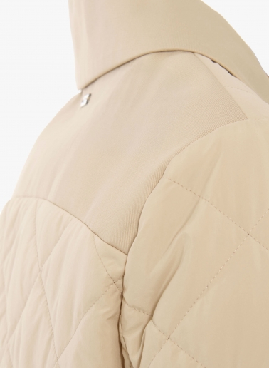 Beige quilted jacket with shirt collar and contrasting details