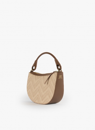 Asymmetrical straw bag with tobacco colour leather details