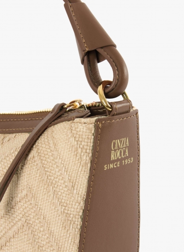 Asymmetrical straw bag with tobacco colour leather details